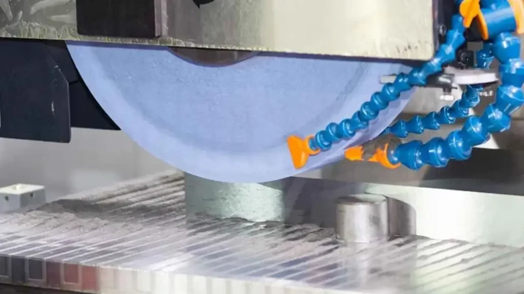 CNC grinding machine in action, precisely grinding a part to improve its surface aesthetics.