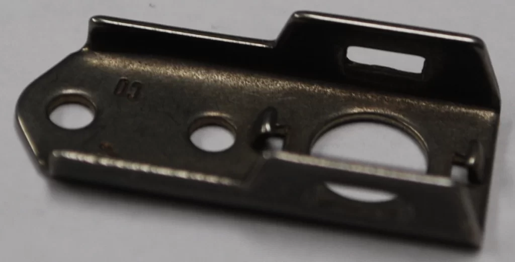 Nickel alloy stamped mounting bracket with multiple bends and cutouts