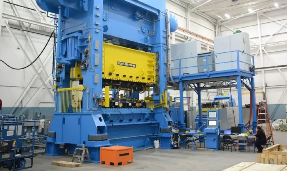 Large servo-driven stamping press in industrial facility