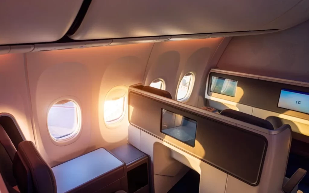 Aircraft cabin interior featuring phenolic composite panels and trim elements