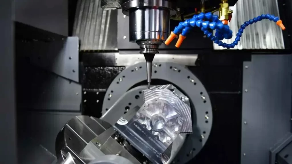 A 5-axis CNC machine in operation. It shapes a component with high precision.