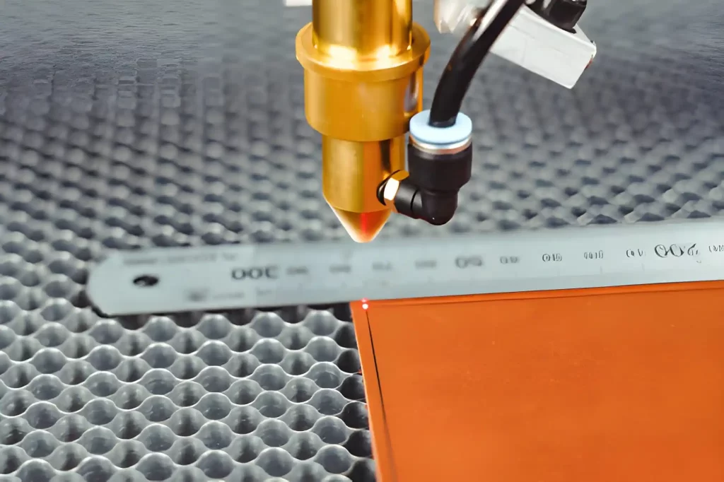 CO2 laser cutter actively cutting a plastic sheet.