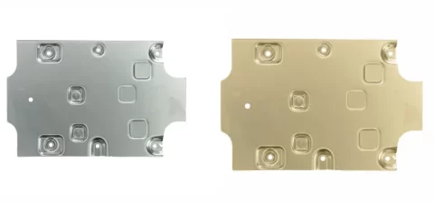 A side-by-side comparison of a raw silver aluminum stamped part and an identical part with a gold-tinted Alodine conversion coating.