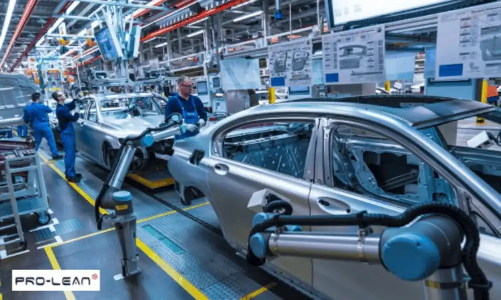 Car assembly line with robotic arms and workers shows modern vehicle production.