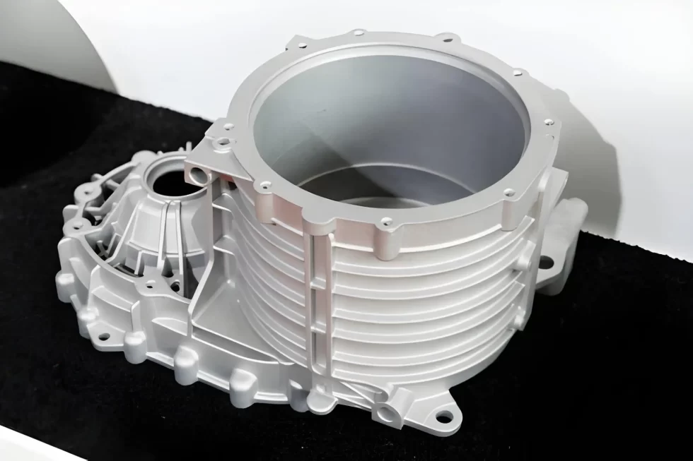 A close-up image of a die-cast automotive engine cover.