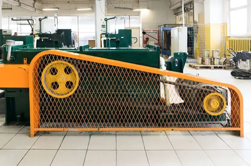 Sheet metal safety barrier frame for machine guarding in a manufacturing facility