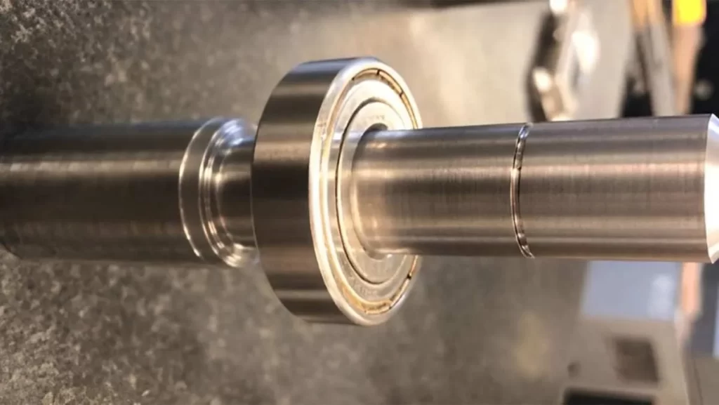 Bearing freely slides onto a metal shaft.