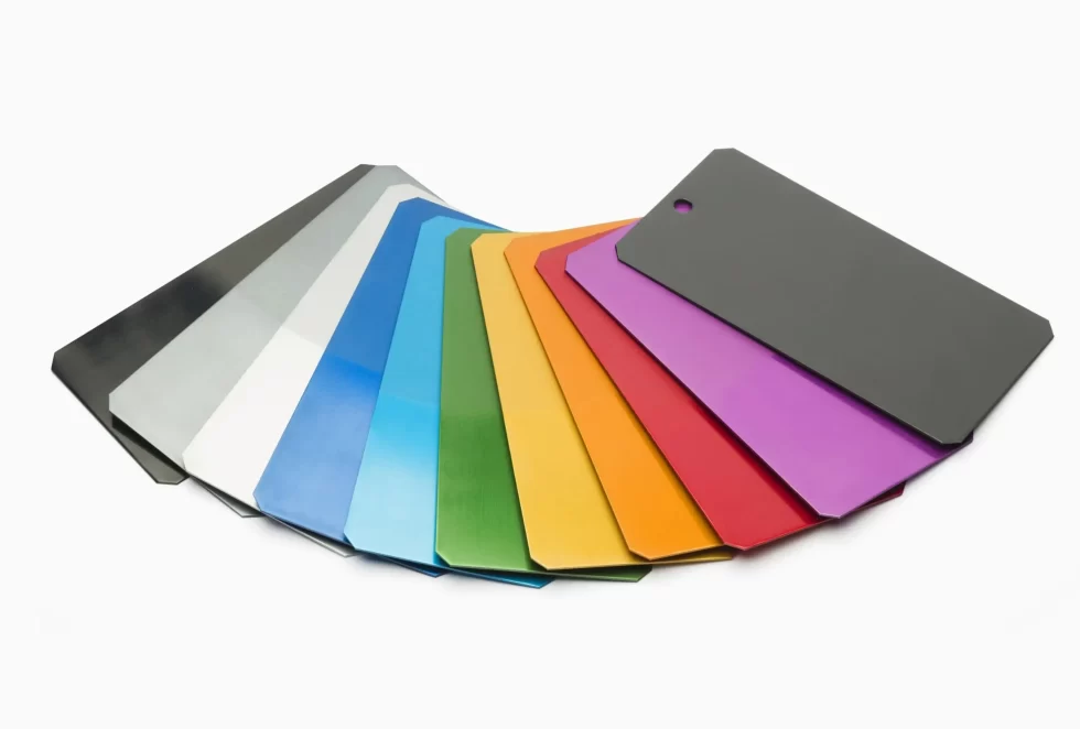 The image shows customized anodized aluminum parts in different colors. 
