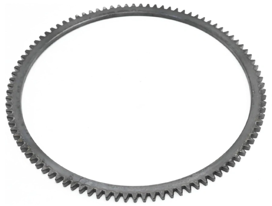 A metal ring gear with multiple teeth around its outer edge
