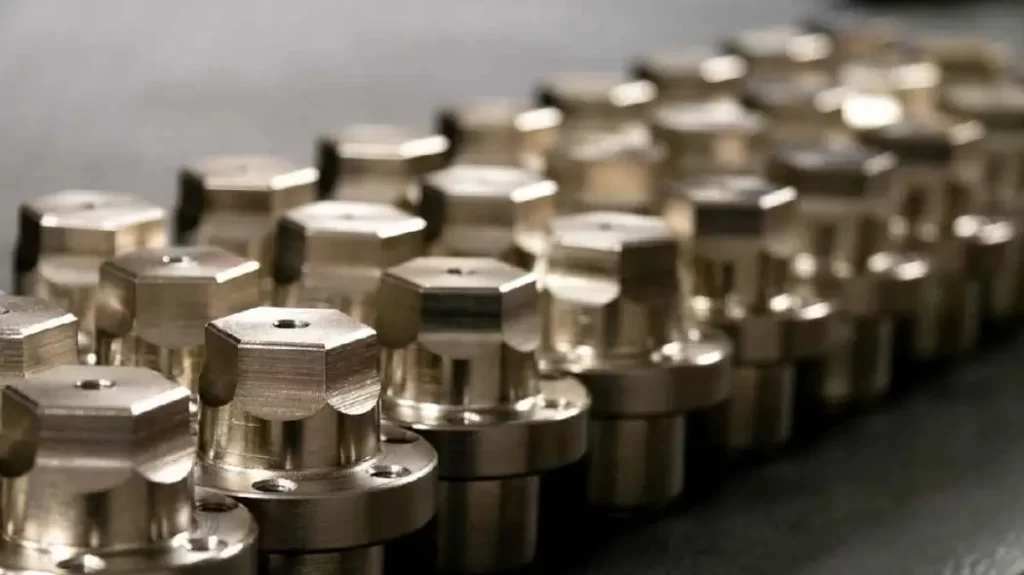 Metal machined parts with identical quality and shapes displayed in a sequence.