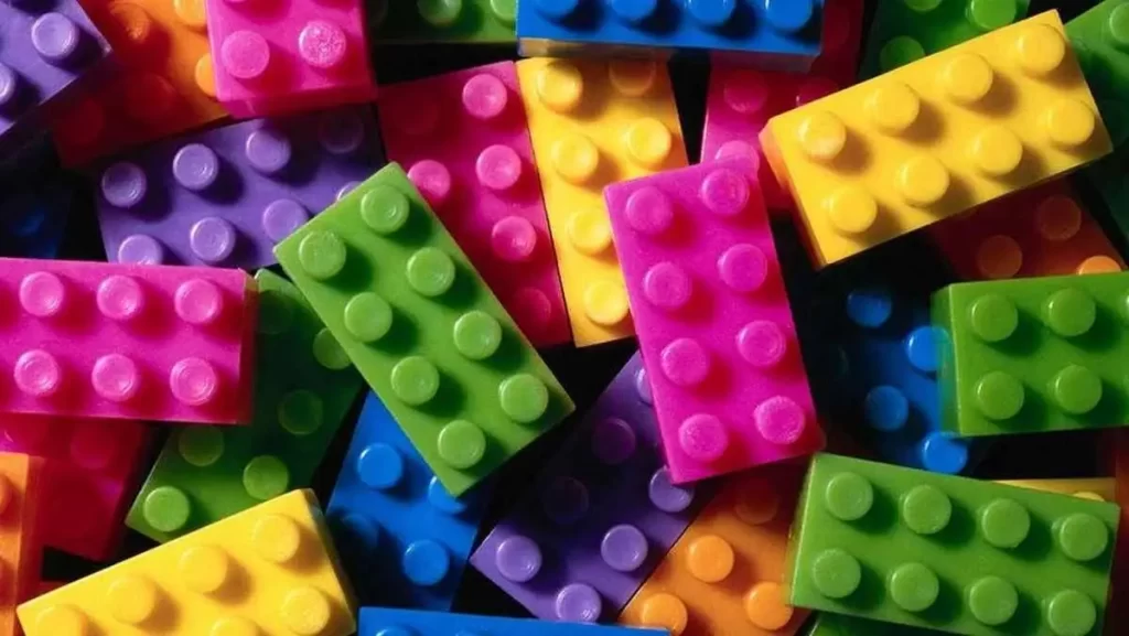 A colorful pile of interlocked plastic building bricks.