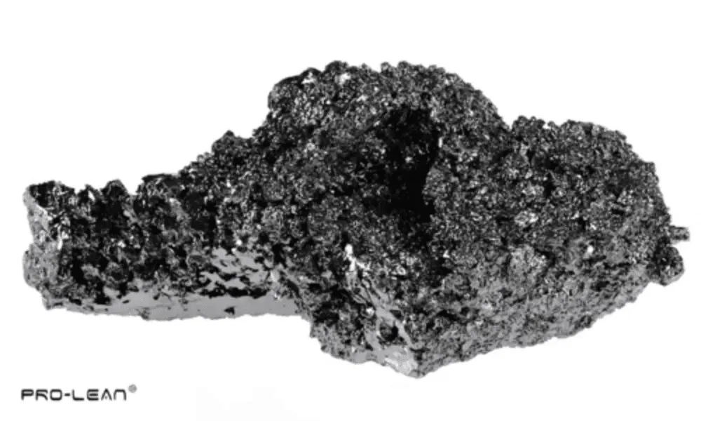 Close-up of a dark, jagged fragment of boron steel with its unique texture and strength.