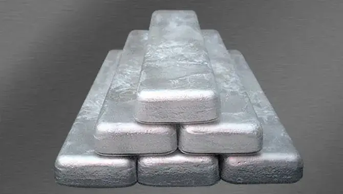 Six blocks of magnesium die casting alloy ingots stacked together, showcasing the material in its solid form