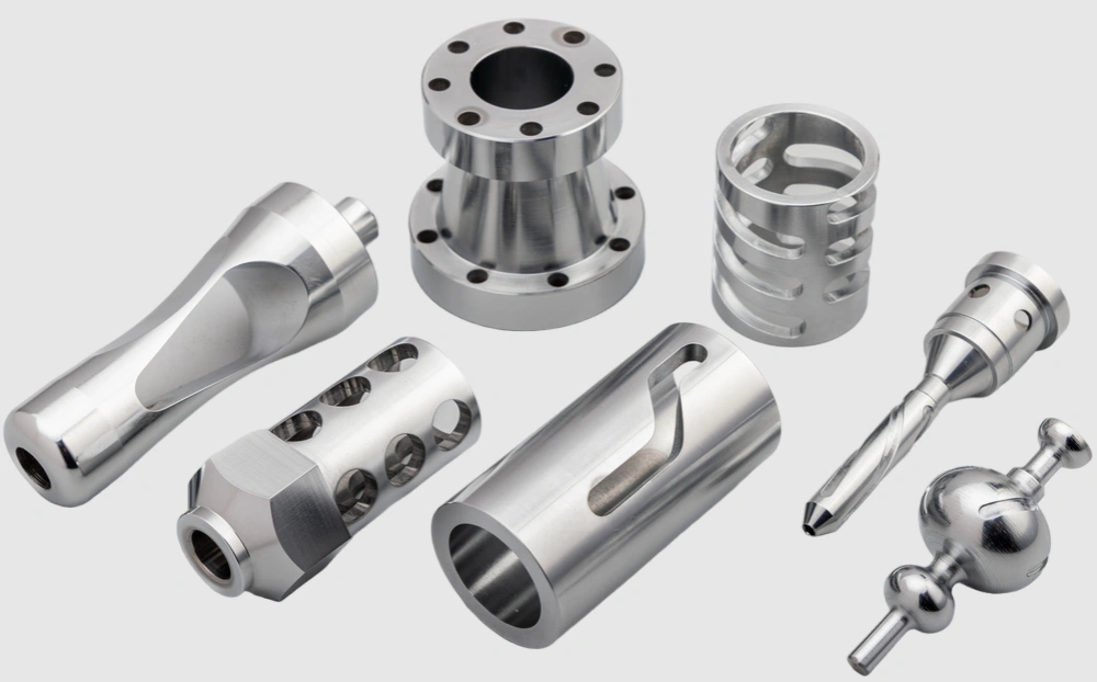 Precision CNC turned stainless steel components, including flanges, shafts, and couplings