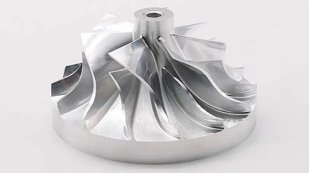 A custom aerospace steel part showing intricate design and precision machining