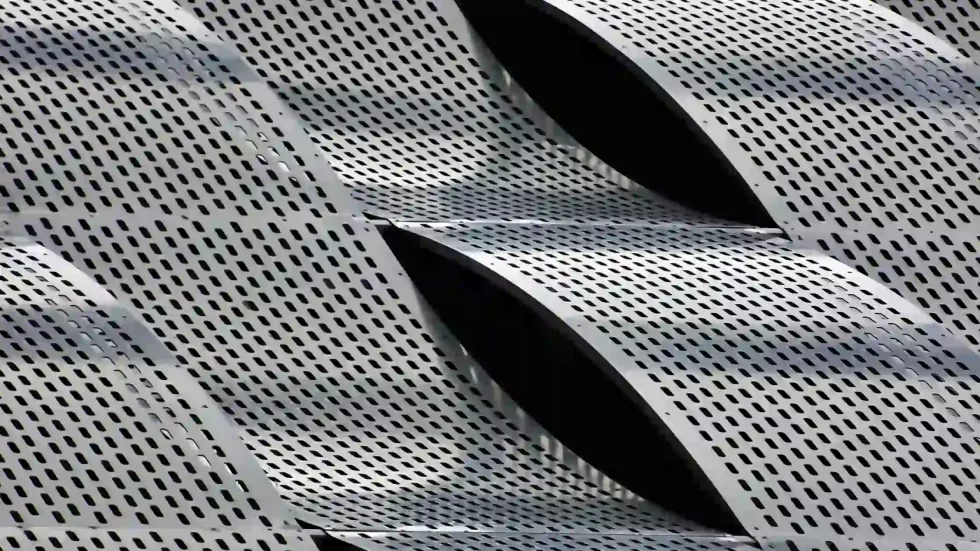 Wavy perforated aluminum sheet metal panels.