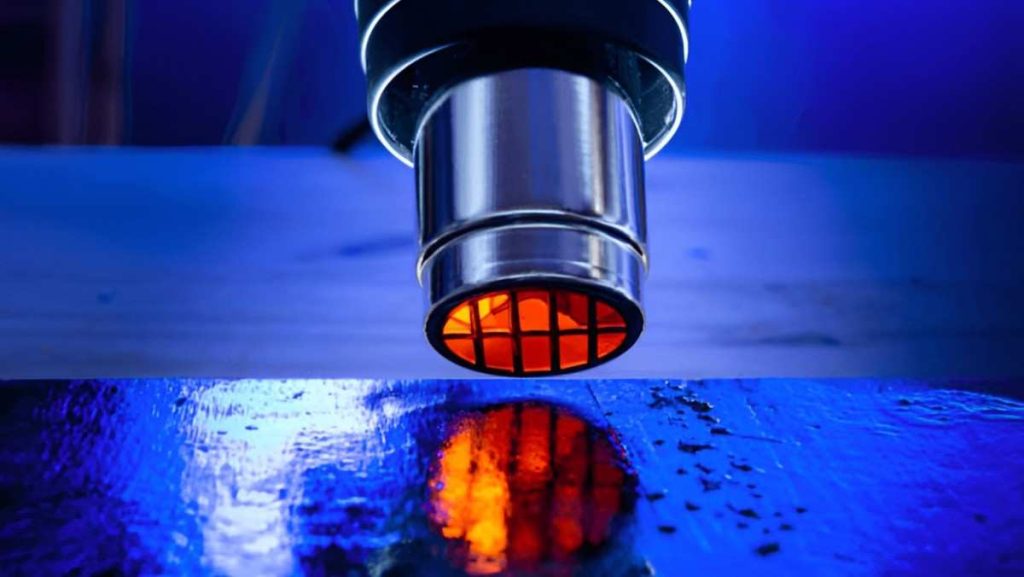 Close-up of emitting orange heat onto a surface.