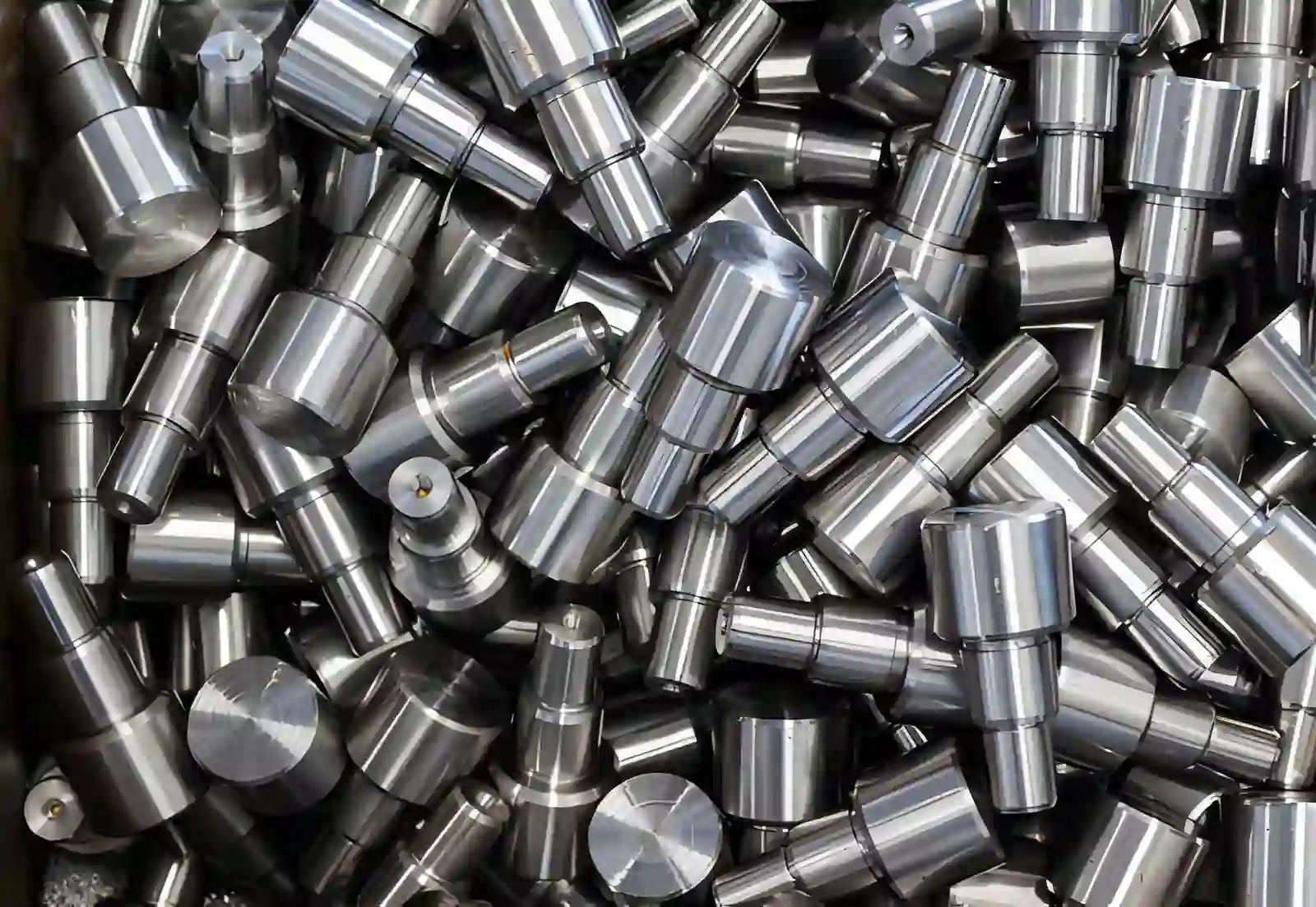 Image of a stack of machined steel automotive parts with a passivated surface.