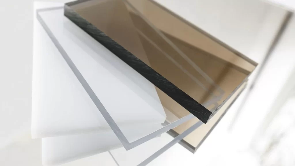 Close-up image of off-white and yellow polycarbonate and acrylic sheets.