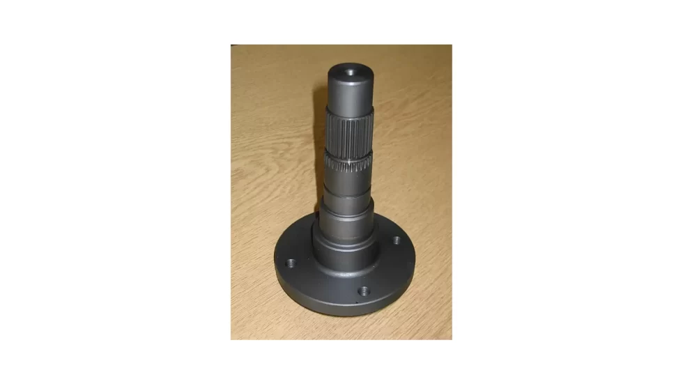 The image shows a machined metal part with a manganese phosphate coating