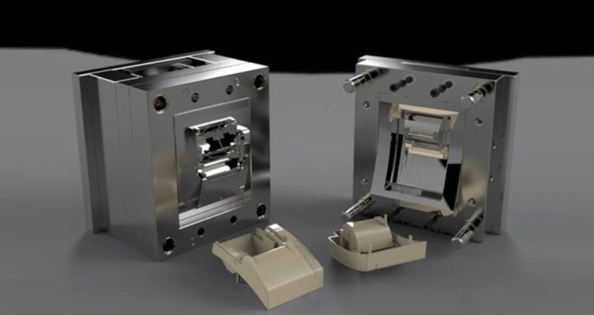 Two PEEK injection molded parts alongside two parts of a mold on a grey and black background