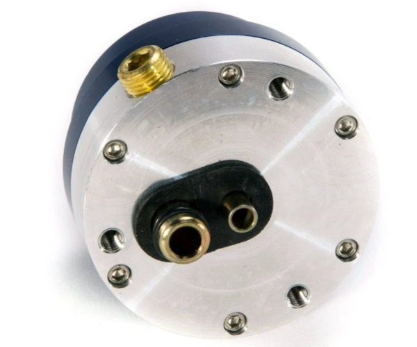 An image of a precision-machined pressure regulator with multiple fasteners, metal housing, and a pair of fuel line ports