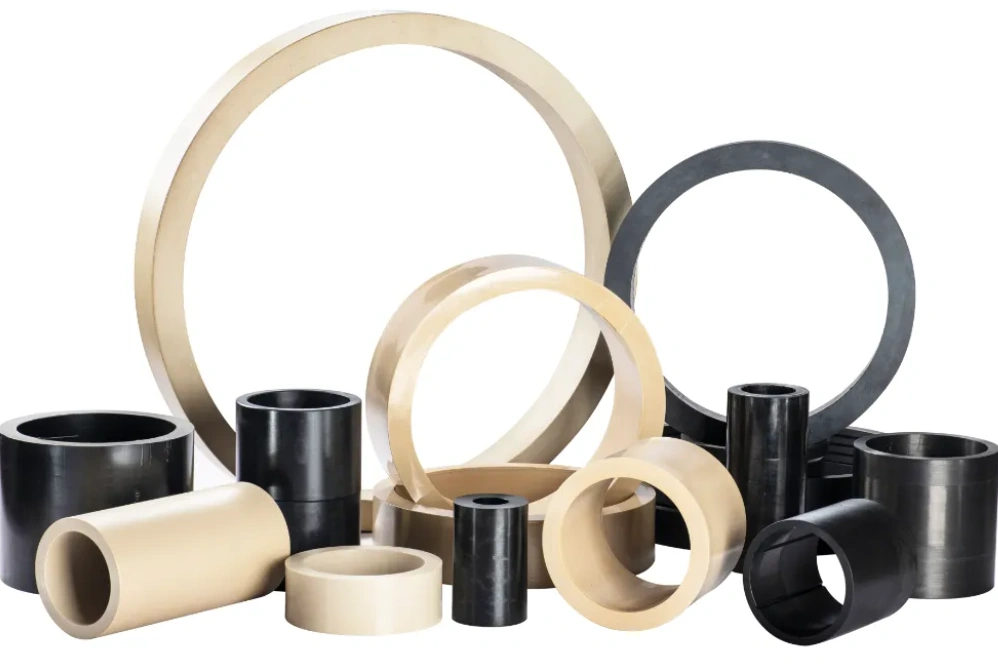 An image of black and grey PEEK tubes and rings