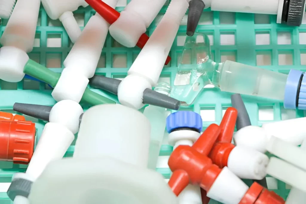 CNC-machined medical parts are displayed with vibrant colours.