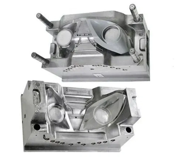 A closeup of two halves of a car headlight molding
