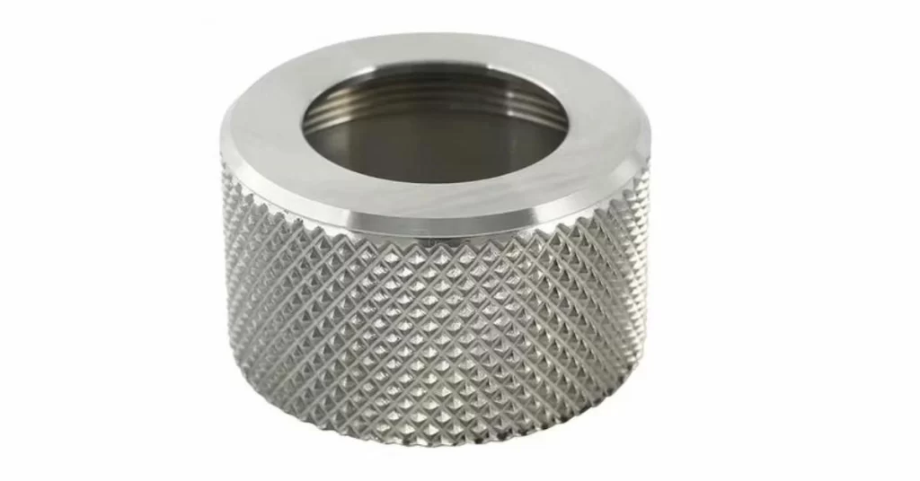An anodized custom steel parts large hole on center and fine knurling on the body