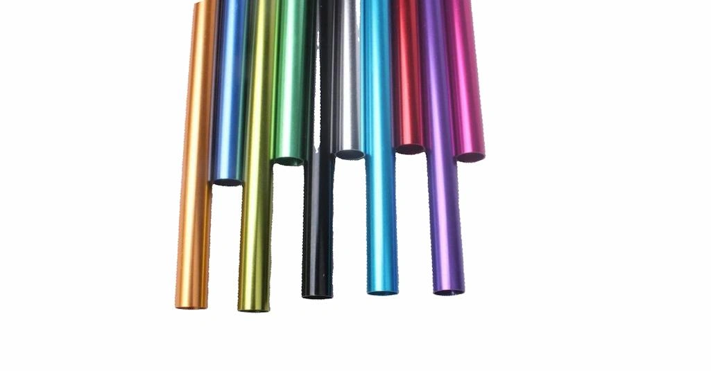 An image showing multiple tubes with diverse colors of steel anodizing