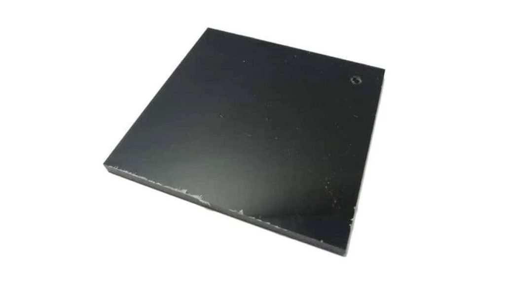 A square, flat black sheet of polydicyclopentadiene (pDCPD).
