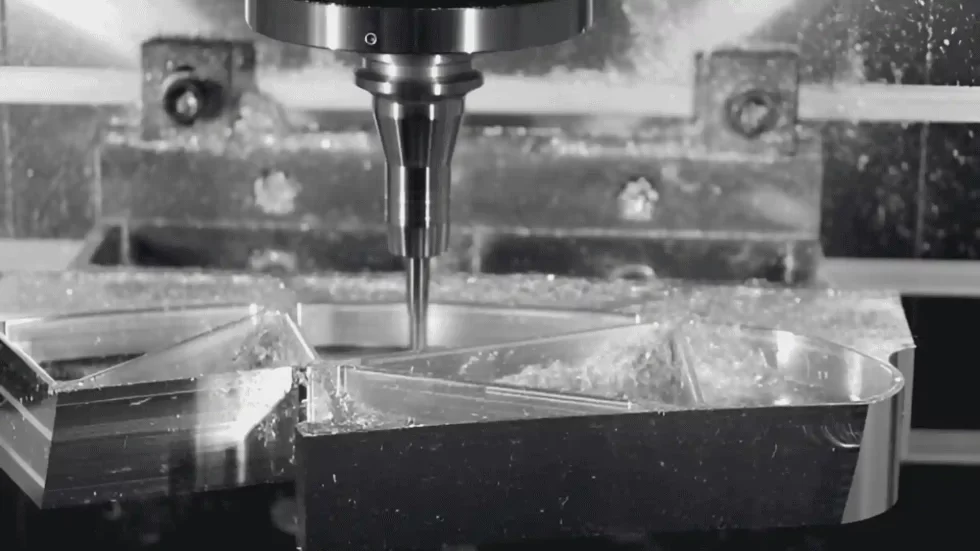 A milling machine cutting an acrylic sheet.