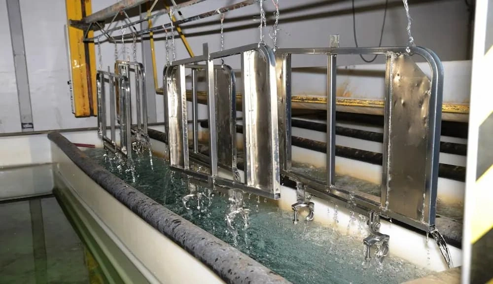 A close-up view of the Cadmium plating process; parts are ready for immersion into the electrolytic batch