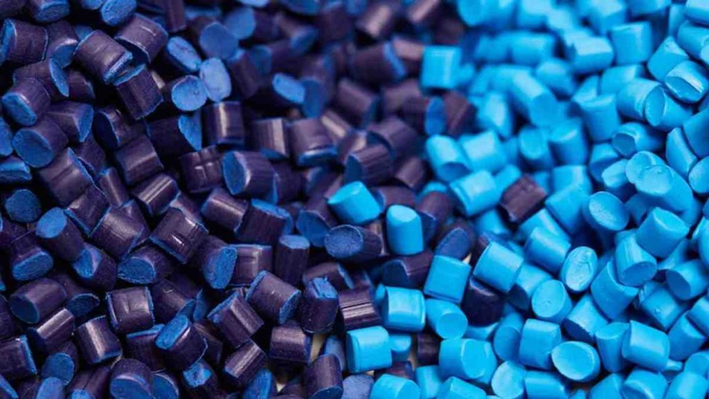 A pile of dark and light blue plastic pellets.