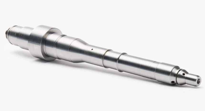 A machined metal automotive shaft with stepped diameters and precision features