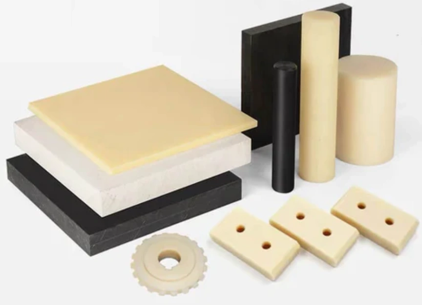 ABS plastic parts in various shapes, including sheets, rods, cylinders, a gear, and mounting blocks in beige, white, and black colors
