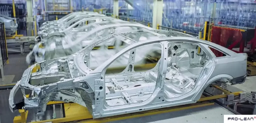 Row of steel car body panels in an automobile factory.