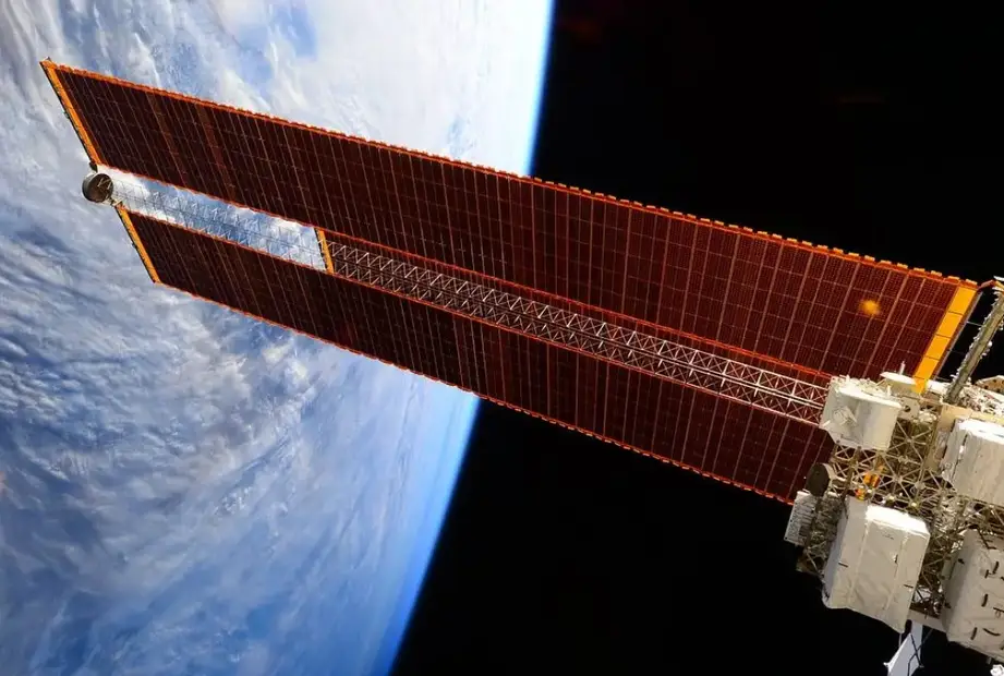 Sizeable solar arrays for a space station with the space in the background