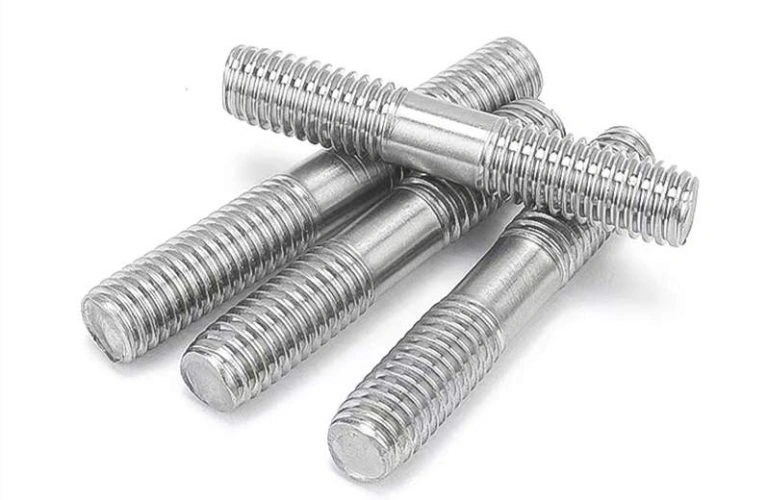 An image showing four stud fasteners, threaded on both ends