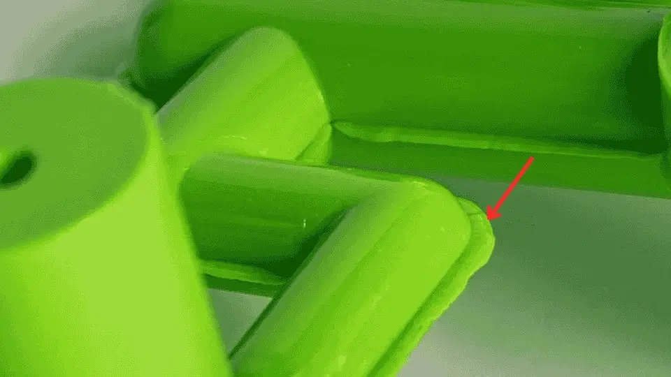 An image showing extra material seen along parting lines due to a poor mold seal.
