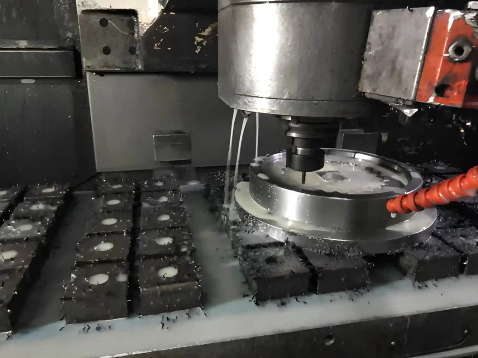 A CNC machine actively cutting titanium material.