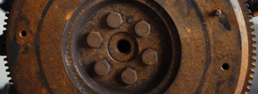A section of a flywheel covered in rust