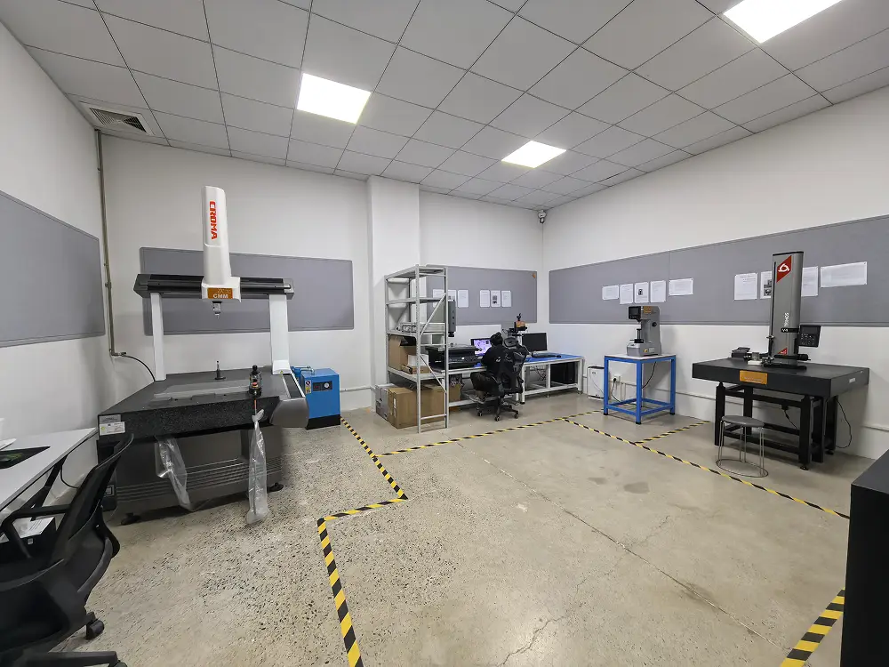 The image depicts the Quality Inspection Room, equipped with climate-controlled air conditioning and various quality inspection equipment, such as CMM (Coordinate Measuring Machine), vision measuring systems, spectrometers, and more