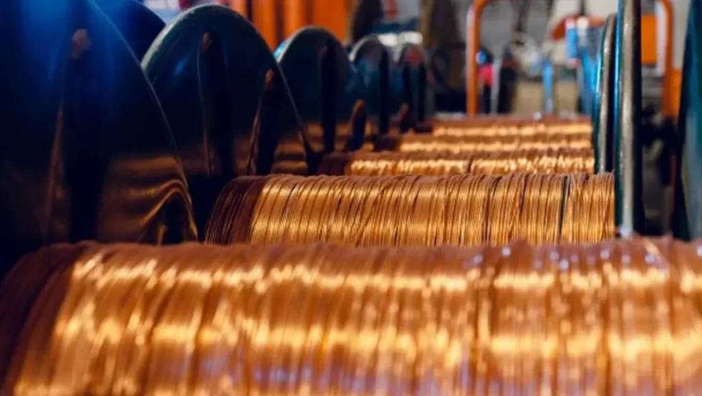 A close-up of shiny copper wire being spooled.