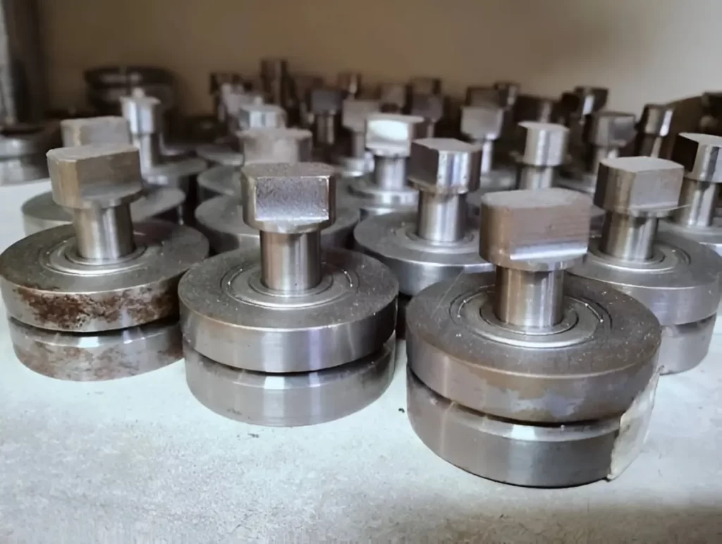 Cast iron industrial machine bearings neatly arranged for display