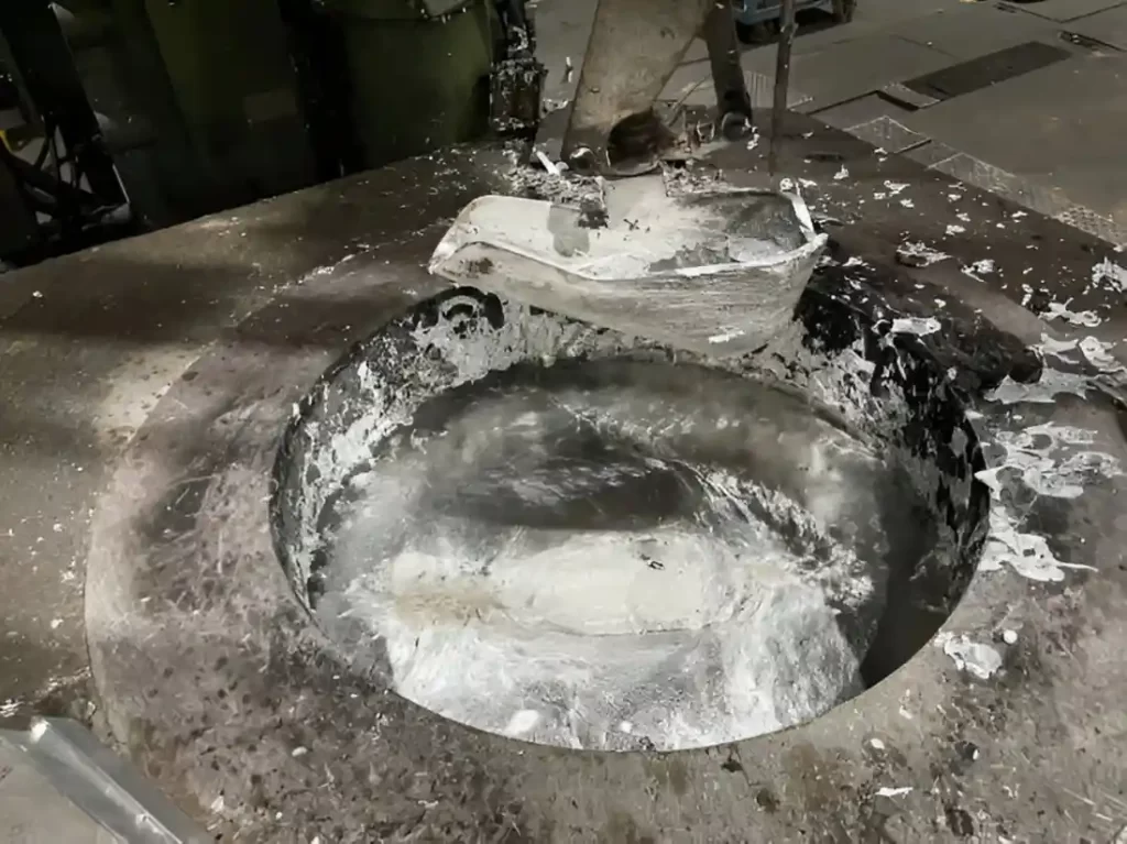 Close-up view of an aluminum melting furnace in operation