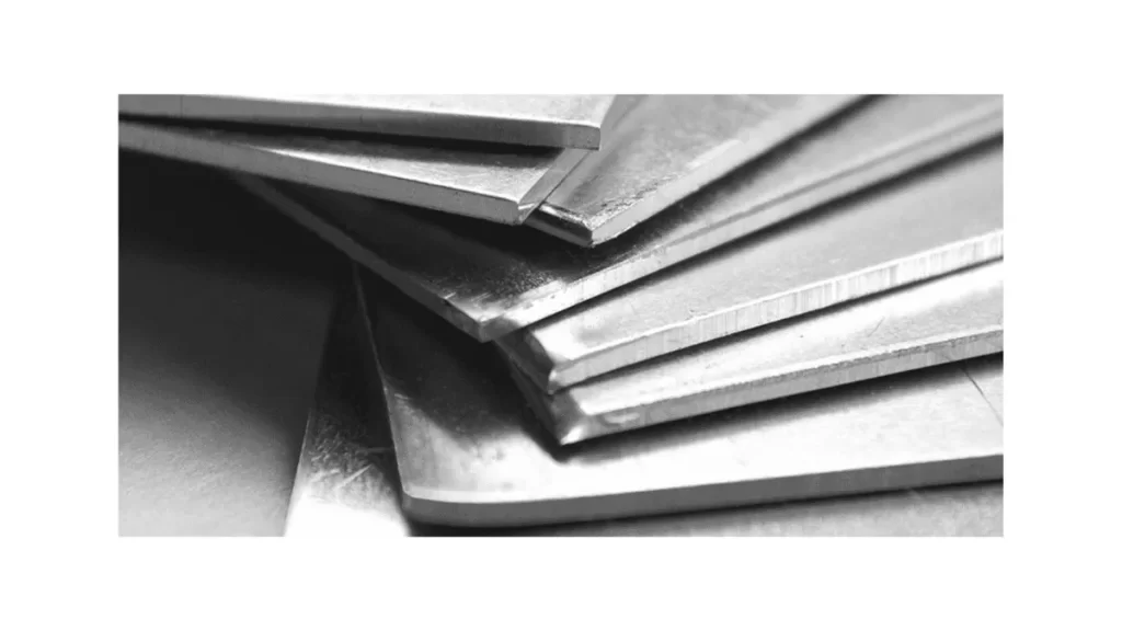 Sheets of quenched and tempered steel with smooth, metallic surfaces are shown.