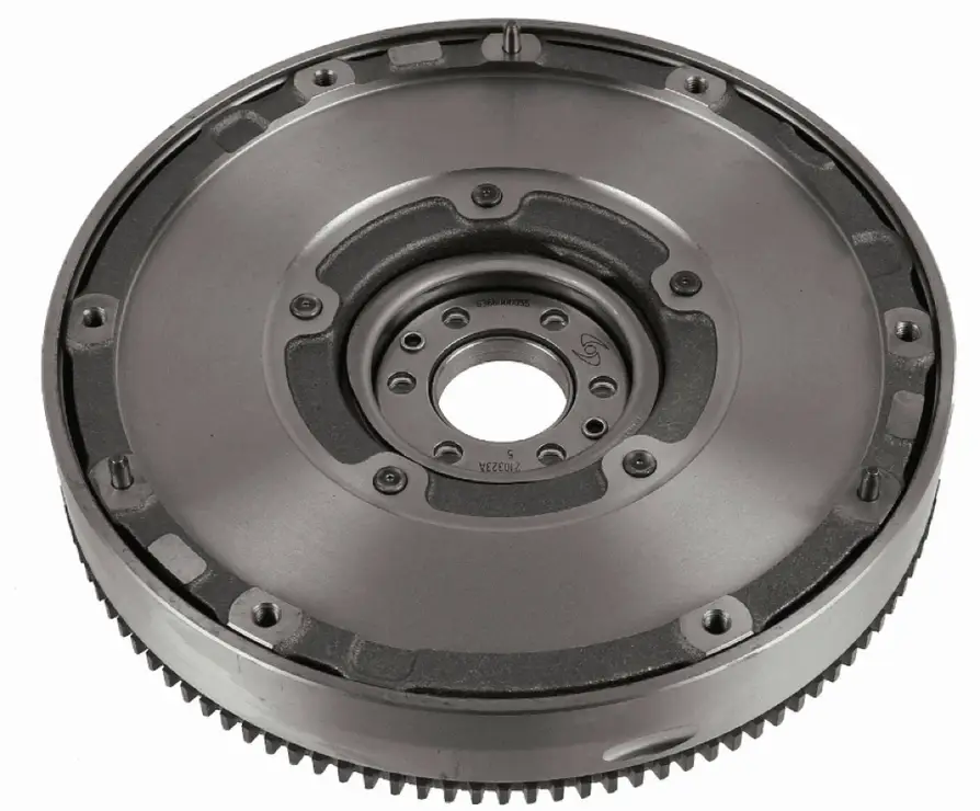 A closeup image of a grey dual-mass flywheel with several mounting holes and a bore